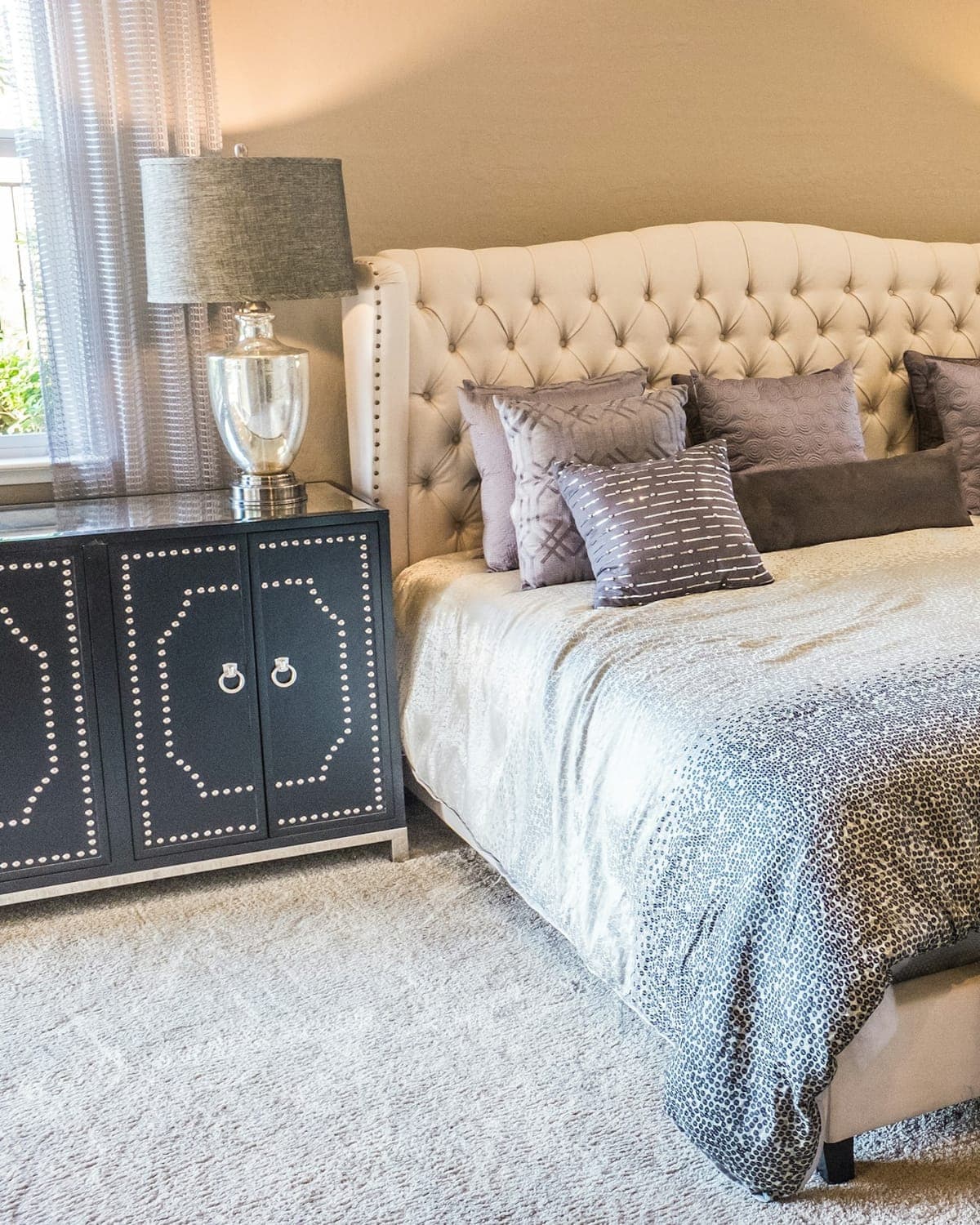 Freshly made bed with folded towels — a close detail of care