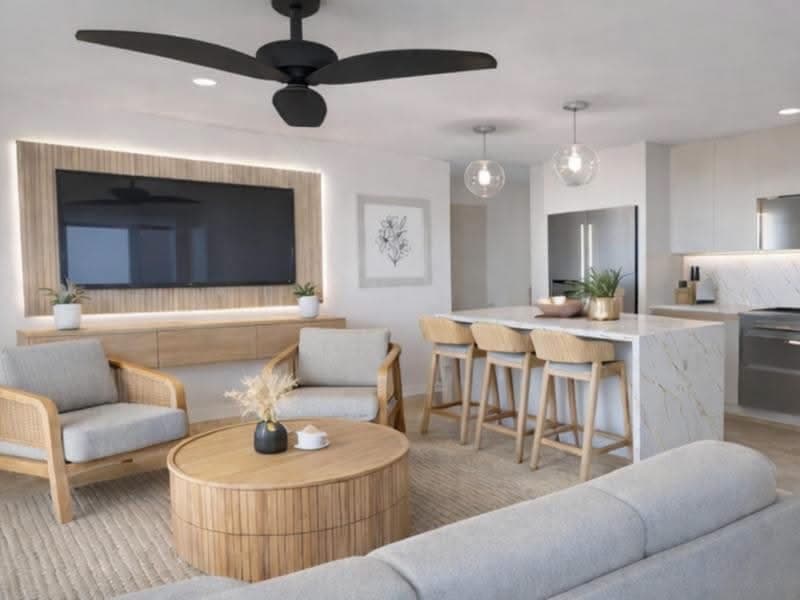 A well-kept Negril villa interior with natural light, open living room to kitchen