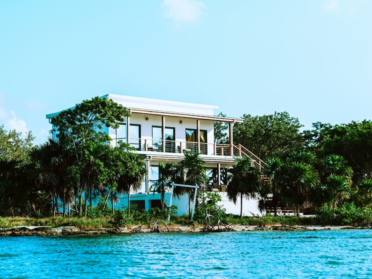 Blue Mahoe House from the water — cliff, garden, terrace above